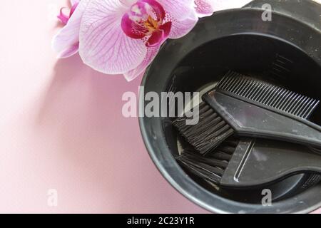 Hairdressing tools with copy space on pink background. Top view. Stock Photo