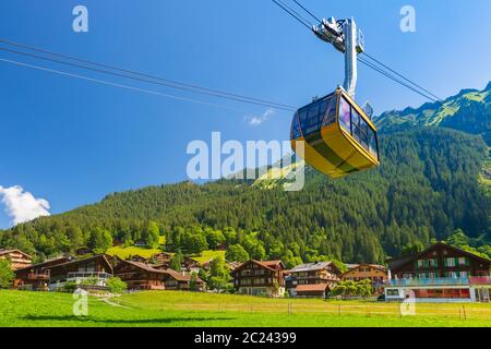 Cable car from mountain village Wengen to viewpoint on cliff in Mannlichen, Switzerland, Bernese Oberland Switzerland Stock Photo