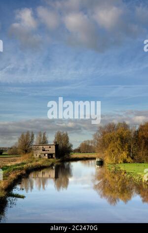 Old shed along the river Giessen near Hoornaar in the Dutch region Alblasserwaard Stock Photo