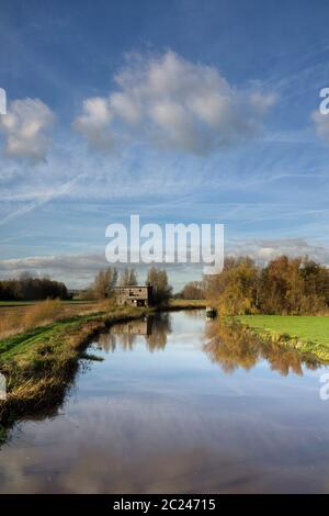 Old shed along the river Giessen near Hoornaar in the Dutch region Alblasserwaard Stock Photo