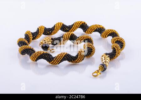 Handmade small bead bracelet in black and gold beads Stock Photo