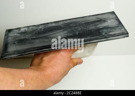 Moss rubber pad for grouting tiles Stock Photo