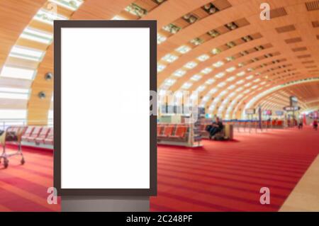 mock up of vertical blank advertising billboard or light box showcase with people waiting at airport, copy space for your text m Stock Photo