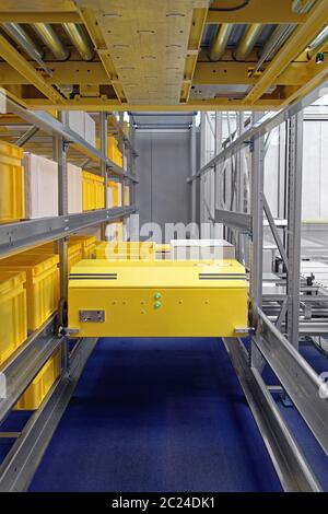 Automated Pallet Shuttle Retrieval System in Distribution Warehouse Stock Photo