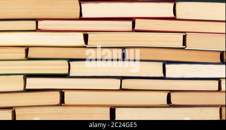 abstract texture from stacks of various hardback books, full frame, concept back to school Stock Photo