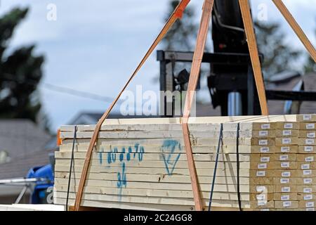 2X4 lumber being delivered to a residential house construction site Stock Photo