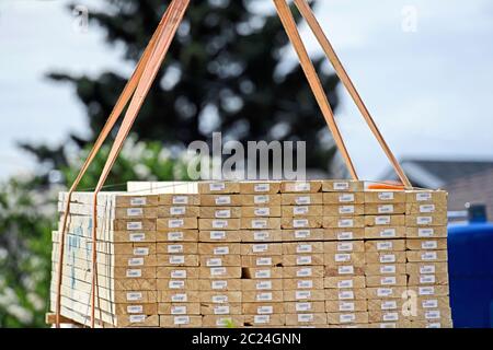 2X4 lumber being delivered to a residential house construction site Stock Photo