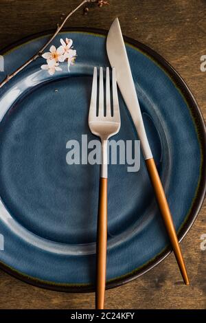Spring table setting with blooming tree branch Stock Photo
