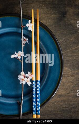 Spring table setting with blooming tree branch Stock Photo