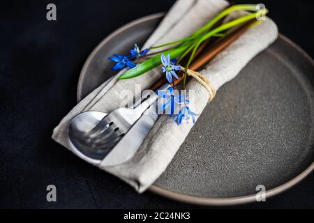 Spring table setting with blue scilla siberica Stock Photo