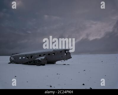 Crashed plane on a snowy field. Photo from March in Iceland Stock Photo