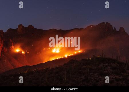 The Bighorn Fire burns dangerously close to homes in the foothills of the Santa Catalina Mountains, Sonoran Desert, Coronado National Forest, Tucson, Stock Photo
