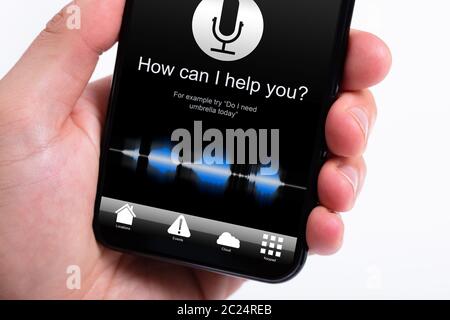 Person Using Voice Recognition Function On Mobile Phone Stock Photo