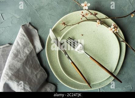 Spring table setting with blooming tree branch Stock Photo