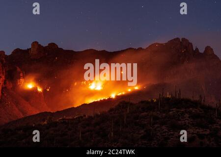 The Bighorn Fire burns dangerously close to homes in the foothills of the Santa Catalina Mountains, Sonoran Desert, Coronado National Forest, Tucson, Stock Photo