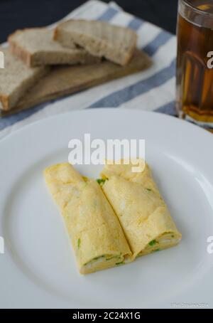 Omellete with herbs and bread, home made with wine Stock Photo