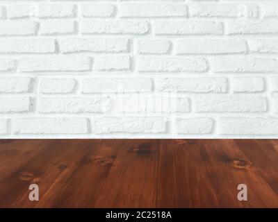 brown wood table with white brick wall texture background. Stock Photo