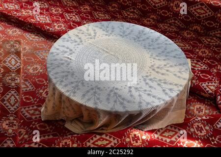 Old style table, floor table with oriental rag in Turkey Stock Photo