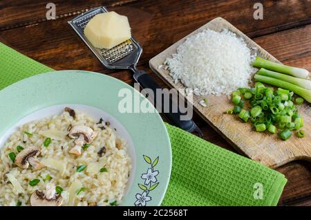 Italien risotto with mushrooms and spring onion Stock Photo