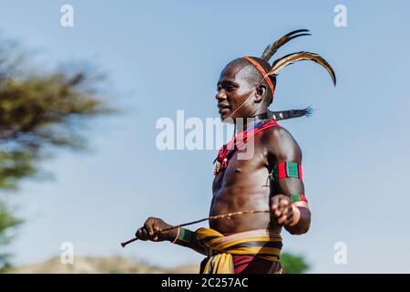OMO VALLEY, ETHIOPIA -  AUGUST 07 2018: The Bull Jumping Ceremony by the unidentified Hamer tribe members Stock Photo