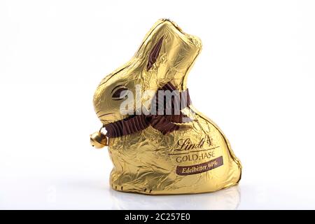 WETZLAR, Germany - April 11, 2020: LINDT Chocolate Rabbit with gift Bow over white background. The story begins in 1845. Founded by the confectioner, Stock Photo