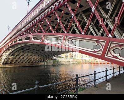 the historic 19th century crown point bridge crossing the river aire in leeds Stock Photo