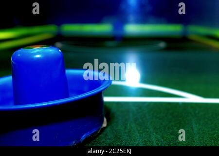 Bright and brilliant air hockey table with instruments for playing. Stock Photo