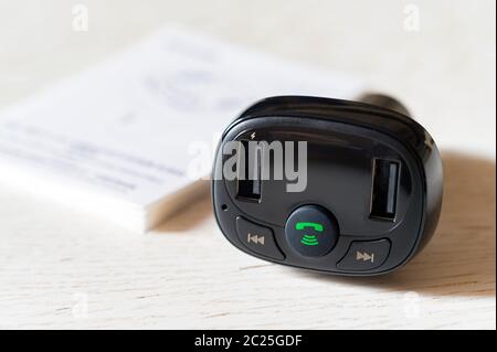 Black USB electronics device car charger with Hands Free and FM transmitter Stock Photo