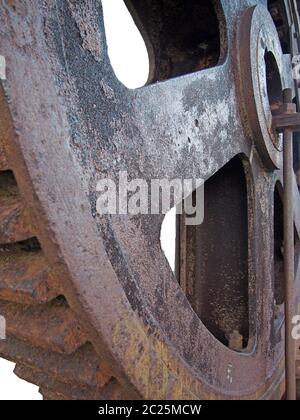 close up of a big steel rusted cog wheel with large gear teeth Stock Photo