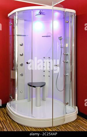 Big Shower Cabin in Corner of Red Bathroom Stock Photo