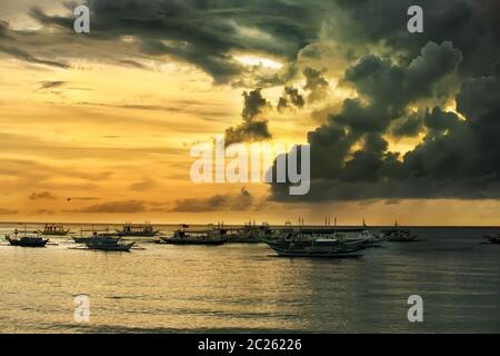 Traditional Philippine boats on sunset. Island Boracay Stock Photo