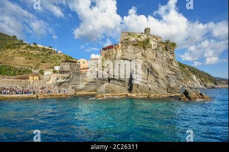 The Castello Doria, the ancient fort along the Ligurian Coast is visible from the sea at the fishing village of Vernazza, Italy, Cinque Terre Stock Photo