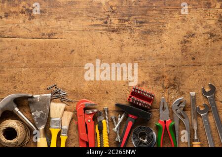 Many tools on a wooden vintage background Stock Photo