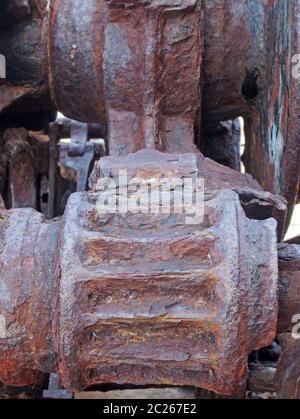 a close up of rusted cogs and gears on an old broken industrial machine Stock Photo