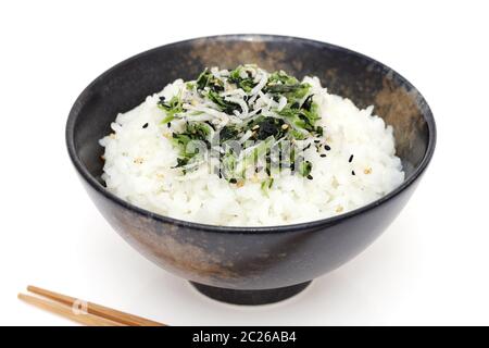Japanese Shirasu and takana vegetable on cooked white rice on white ...