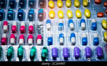 Colorful of tablets and capsules pill in blister packaging arranged with beautiful pattern. Pharmaceutical industry concept. Pharmacy drugstore. Defec Stock Photo
