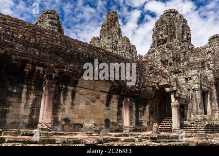 Bayon, smiling stone faces on towers, Buddhist temple of Khmer Empire, at centre of Angkor Thom ruins, Siem Reap, Cambodia, Southeast Asia, Asia Stock Photo