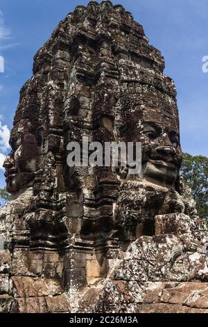 Bayon, smiling stone faces on towers, Buddhist temple of Khmer Empire, at centre of Angkor Thom ruins, Siem Reap, Cambodia, Southeast Asia, Asia Stock Photo