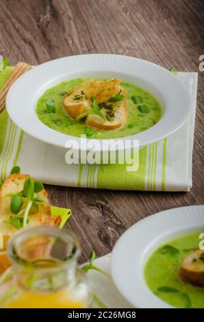 Spring peas soup, beautiful composition, 2 soups, one focus, juice and fennel Stock Photo