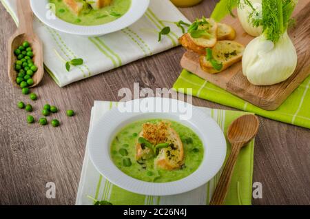 Spring peas soup, beautiful composition, 2 soups, one focus, juice and fennel Stock Photo