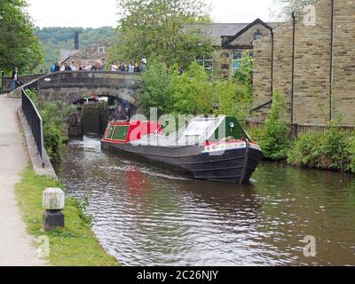 vintage boats traveling to the historic narrow boat club gathering held on the may bank holiday on the rochdale canal at hebden Stock Photo