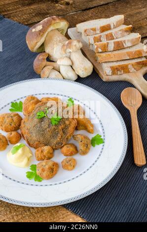 Fried mushrooms with home made bread, mushrooms from czech woods Stock Photo