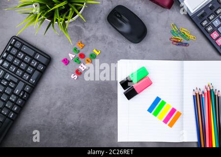 The layout of school supplies on a dark gray background. The view from the top. Back to school. Flat lay Stock Photo