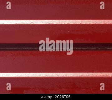 Diagonal pattern of metal profile. Fences from the galvanized iron painted by a polymeric covering. Stock Photo