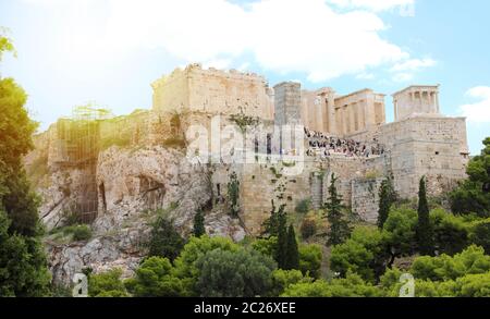 ATHENS, GREECE - JULY 18, 2018: close up view of famous Acropolis with people who visit the Parthenon, Erechtheum, Propylaea and Temple of Athena in t Stock Photo