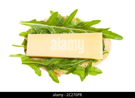top view of open sandwich with fresh bread, cheese and green arugula leaves isolated on white background Stock Photo