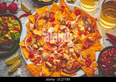 Mexican corn nacho spicy chips served with melted cheese Stock Photo