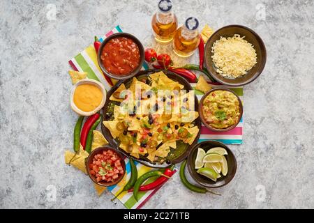 Mexican corn nacho spicy chips served with melted cheese Stock Photo