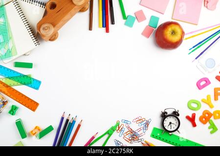school supplies: multicolored wooden pencils, paper stickers, paper clips, pencil sharpener, copy space Stock Photo