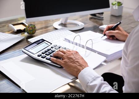 Accountant Working At The Office On Financial Documents Stock Photo